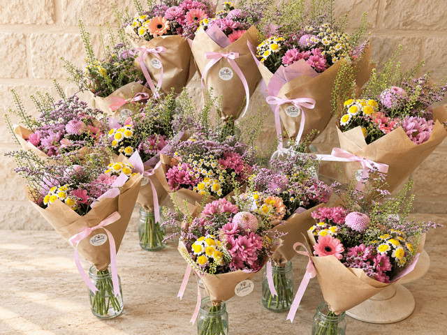 Pink, purple and yellow Bloemist Club bouquets with natural meadow-style flowers