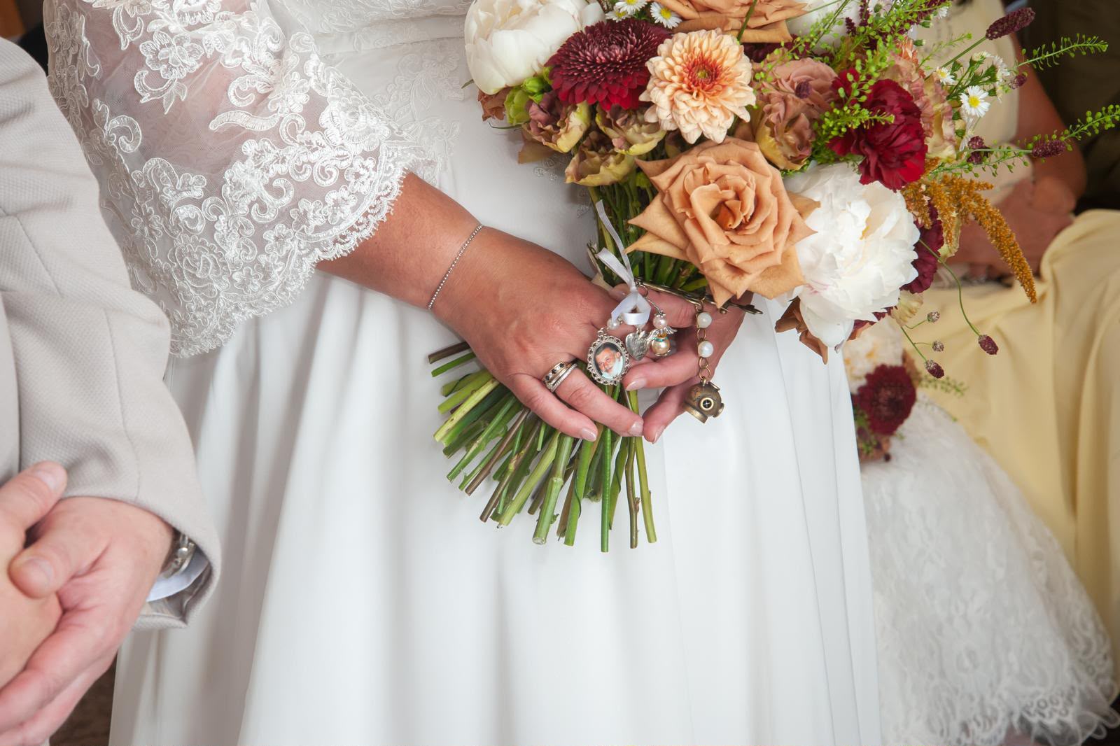 An autumn bridal bouquet with terracotta roses and textured seasonal flowers